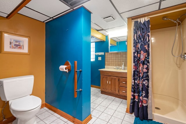 1314 Wesley Ave, Berwyn, IL 60402 - bathroom featuring a drop ceiling, a stall shower, vanity, and tile patterned flooring