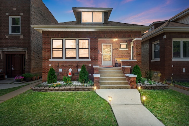 1314 Wesley Ave, Berwyn, IL 60402 - view of front facade with brick siding, a porch, and a lawn