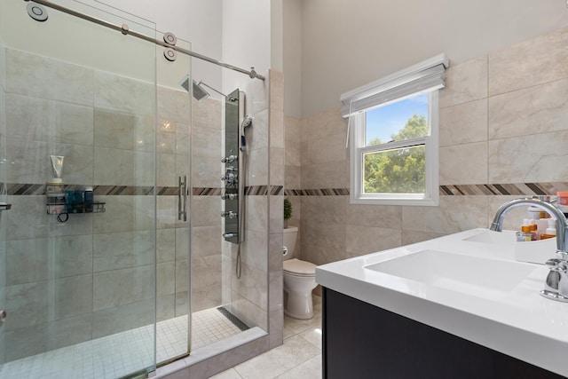 290 Knox Park Rd, Lake Zurich, IL 60047 - bathroom featuring tile walls, a shower stall, tile patterned floors, and vanity