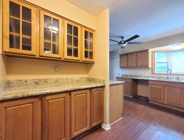595 W Elk Grove Blvd, Elk Grove Village, IL 60007 - kitchen with dark wood-style flooring, a ceiling fan, glass insert cabinets, and brown cabinets