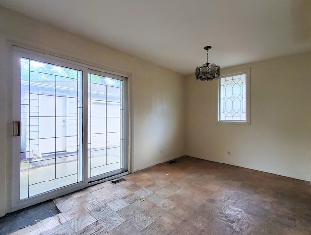 595 W Elk Grove Blvd, Elk Grove Village, IL 60007 - unfurnished dining area with healthy amount of natural light and a chandelier