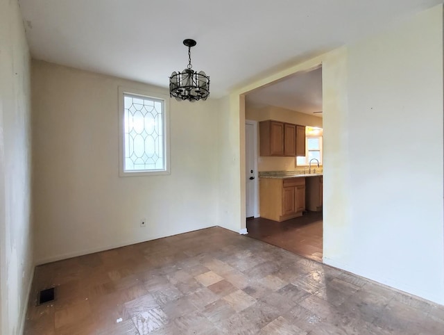 595 W Elk Grove Blvd, Elk Grove Village, IL 60007 - unfurnished dining area with a chandelier and a sink