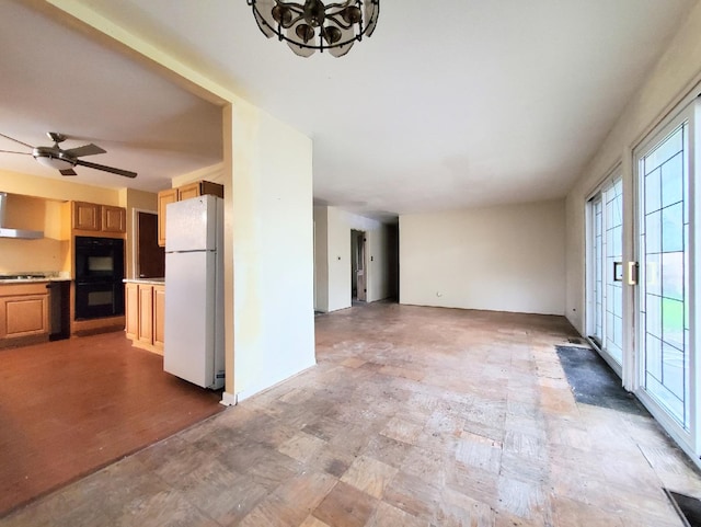 595 W Elk Grove Blvd, Elk Grove Village, IL 60007 - unfurnished living room featuring plenty of natural light, ceiling fan, and stone finish flooring