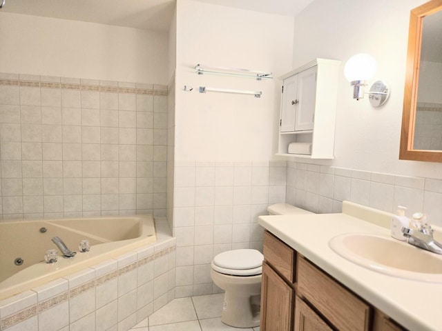 1928 Hidden Valley Dr, Lanark, IL 61046 - bathroom with tile walls, a whirlpool tub, tile patterned flooring, vanity, and a wainscoted wall