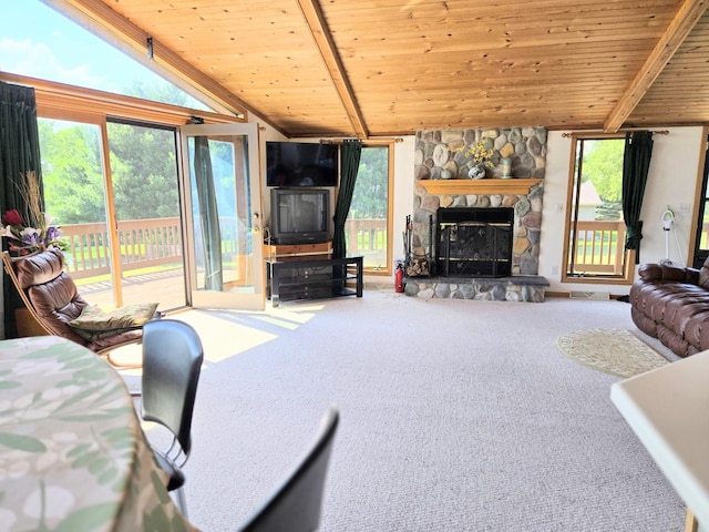 1928 Hidden Valley Dr, Lanark, IL 61046 - living area with wood ceiling, carpet floors, healthy amount of natural light, and a stone fireplace