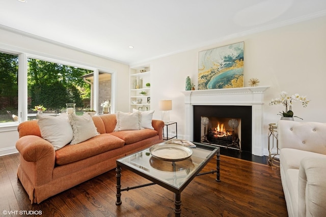 622 Kenilworth Ave, Kenilworth, IL 60043 - living room with wood finished floors, a fireplace with flush hearth, built in features, and ornamental molding