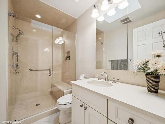 622 Kenilworth Ave, Kenilworth, IL 60043 - full bath featuring a stall shower, vanity, tile patterned floors, and a skylight
