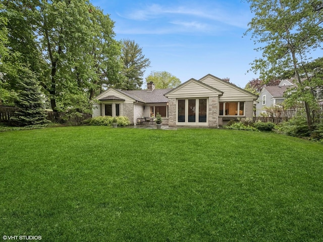 622 Kenilworth Ave, Kenilworth, IL 60043 - back of property featuring a chimney, a patio, and brick siding