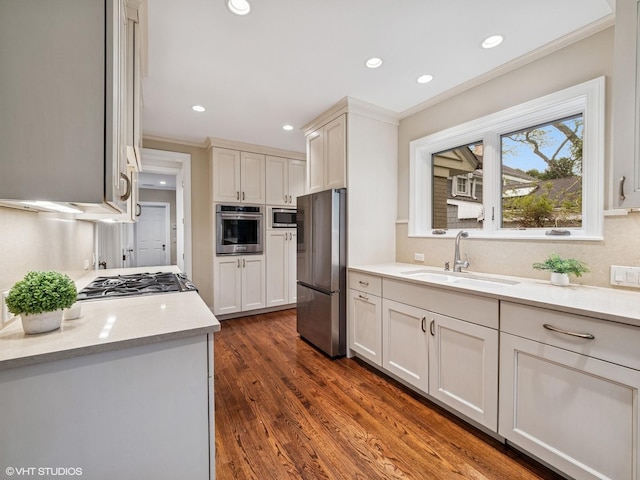 622 Kenilworth Ave, Kenilworth, IL 60043 - kitchen featuring stainless steel appliances, crown molding, recessed lighting, dark wood-type flooring, and white cabinets