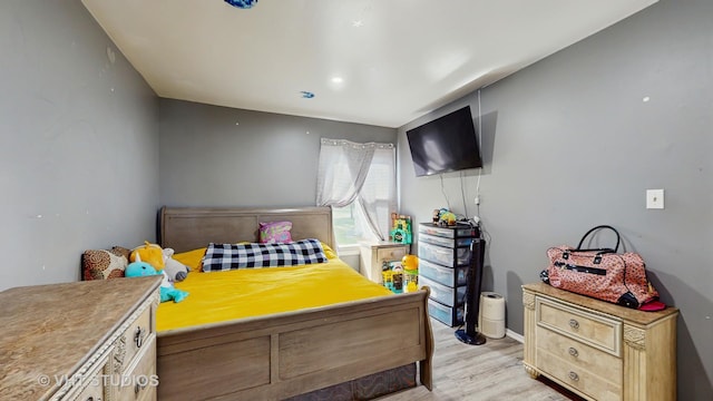 1320 N Glen Cir Unit B, Aurora, IL 60506 - bedroom with light wood-style flooring and baseboards