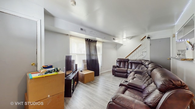 1320 N Glen Cir Unit B, Aurora, IL 60506 - living area featuring light wood finished floors and stairs
