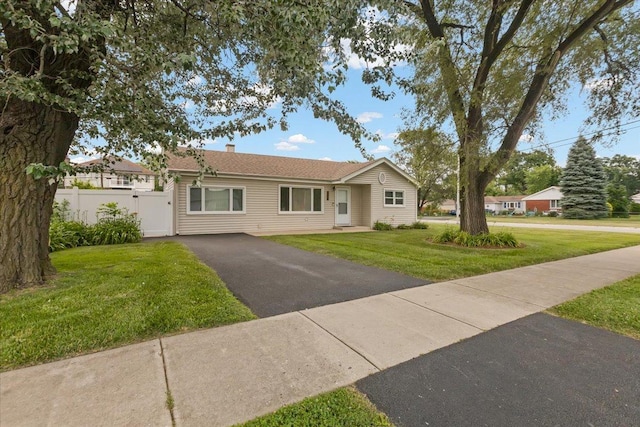 8255 Lockwood Ave, Burbank, IL 60459 - ranch-style home with asphalt driveway, a chimney, and a gate
