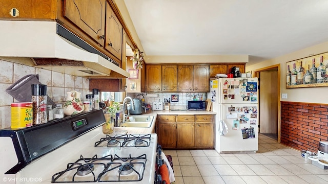 8824 Cherry Ave, River Grove, IL 60171 - kitchen with white appliances, under cabinet range hood, light countertops, and brown cabinets