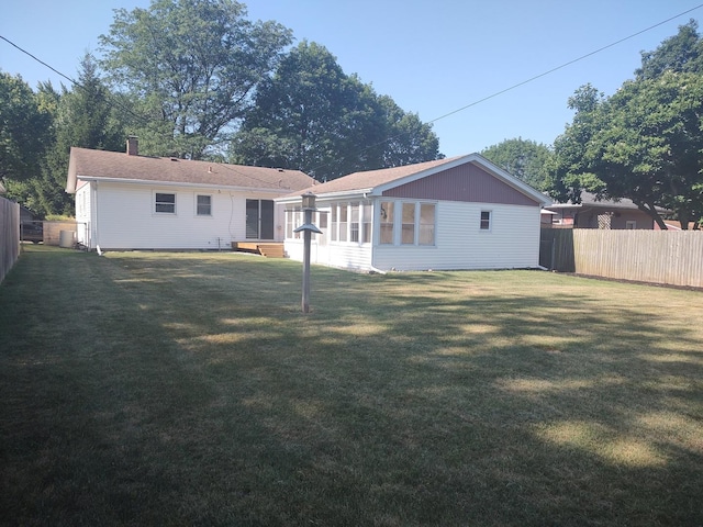 406 Highland St, Belvidere, IL 61008 - back of house featuring a sunroom and a chimney