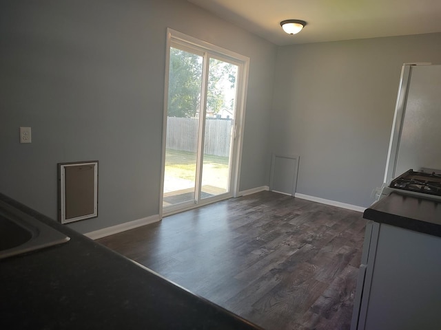 406 Highland St, Belvidere, IL 61008 - unfurnished dining area featuring dark wood finished floors