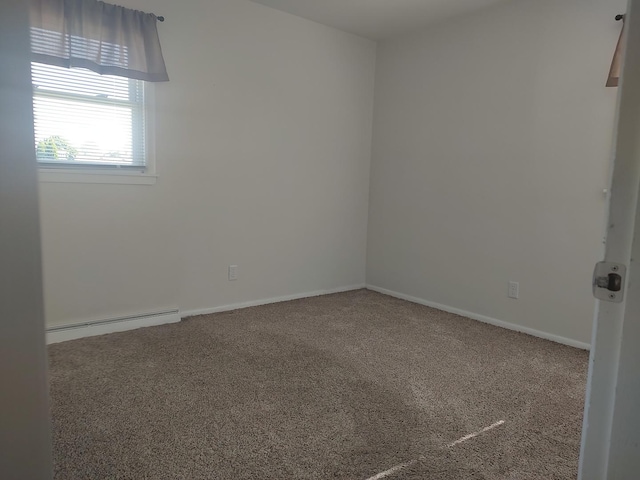 406 Highland St, Belvidere, IL 61008 - empty room featuring a baseboard heating unit and carpet flooring