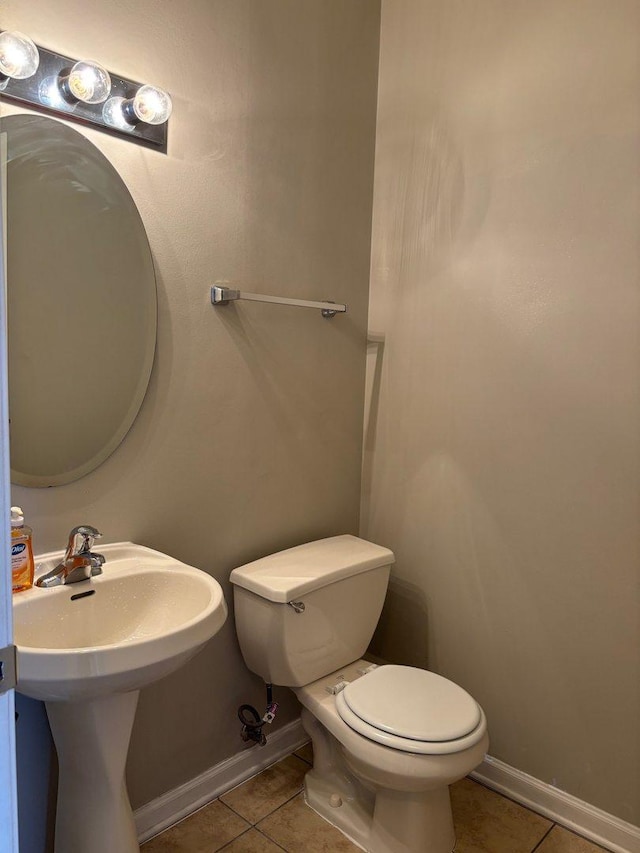 331 E 17th St, Chicago, IL 60616 - half bath featuring tile patterned floors and toilet
