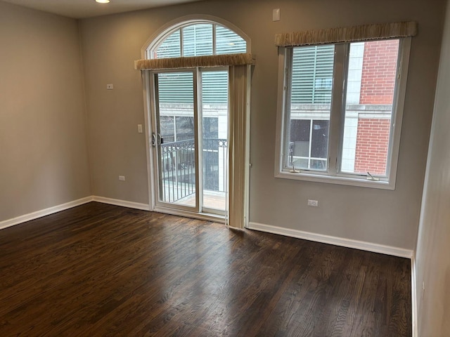 331 E 17th St, Chicago, IL 60616 - spare room featuring baseboards and wood finished floors