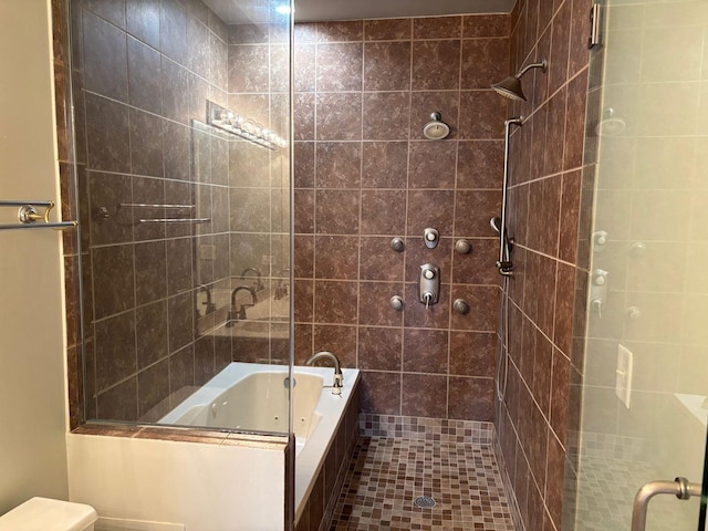331 E 17th St, Chicago, IL 60616 - bathroom with a tile shower, a jetted tub, and tile patterned flooring
