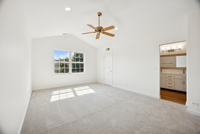 2566 Camberley Cir, Westchester, IL 60154 - unfurnished bedroom with carpet flooring, vaulted ceiling, ensuite bathroom, and a ceiling fan