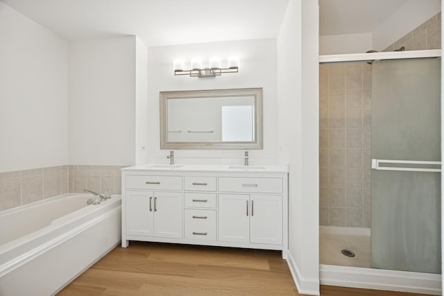 2566 Camberley Cir, Westchester, IL 60154 - full bath with a shower stall, double vanity, a garden tub, and wood finished floors