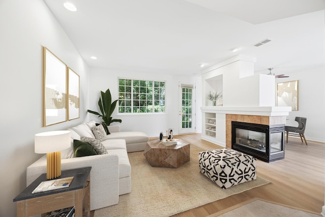 2566 Camberley Cir, Westchester, IL 60154 - living area featuring wood finished floors, recessed lighting, and a tile fireplace