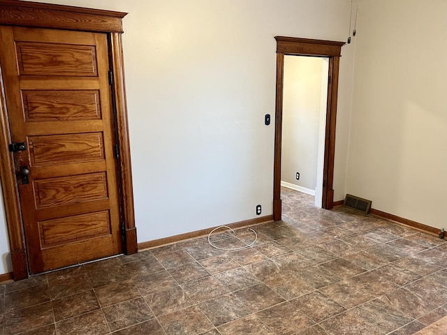 109 E Minnesota St, Spring Valley, IL 61362 - empty room featuring stone finish floors and baseboards