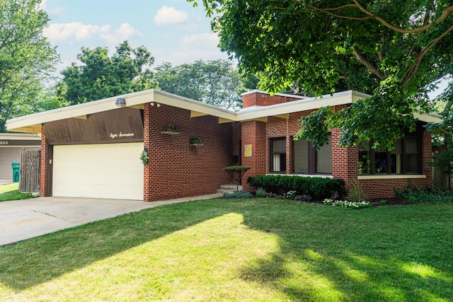 817 Meadow Ln, Sycamore, IL 60178 - view of front of property featuring a garage, concrete driveway, a front yard, and brick siding