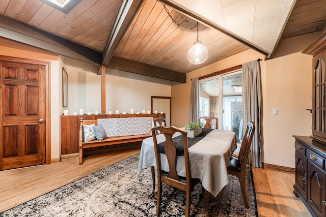 817 Meadow Ln, Sycamore, IL 60178 - dining area featuring light wood-style flooring and a wooden ceiling with exposed beams