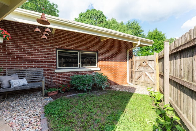 817 Meadow Ln, Sycamore, IL 60178 - view of home's exterior featuring brick siding and a gate