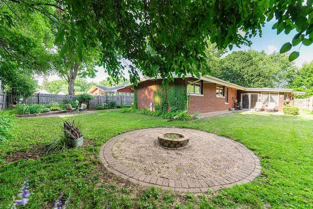 817 Meadow Ln, Sycamore, IL 60178 - fenced backyard featuring an outdoor fire pit and a patio
