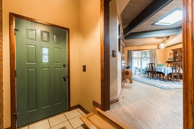 817 Meadow Ln, Sycamore, IL 60178 - entrance foyer with a wooden ceiling with exposed beams and light tile patterned floors
