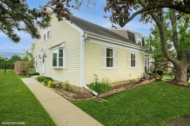 7400 Nantucket Cv, Hanover Park, IL 60133 - view of side of home with a yard and a shingled roof