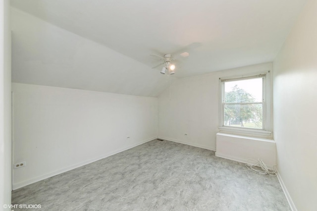 7400 Nantucket Cv, Hanover Park, IL 60133 - additional living space with vaulted ceiling, ceiling fan, and carpet