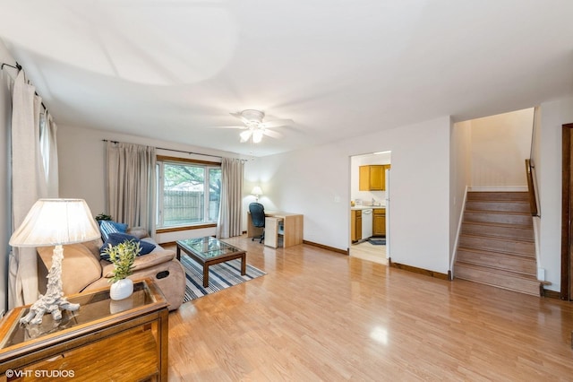 7400 Nantucket Cv, Hanover Park, IL 60133 - living area featuring stairway, ceiling fan, and light wood-style floors
