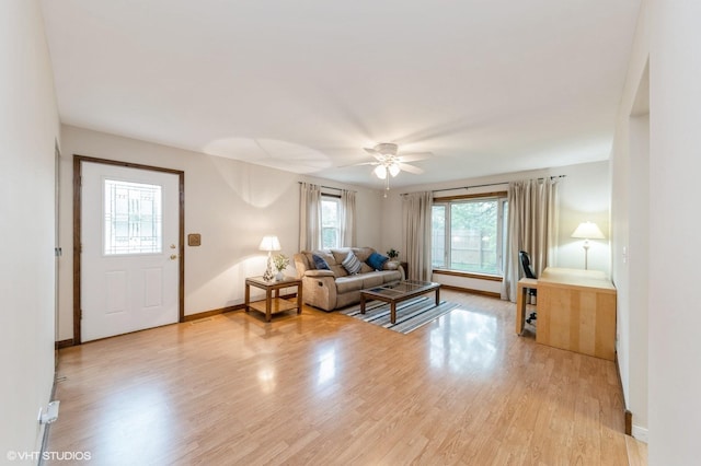 7400 Nantucket Cv, Hanover Park, IL 60133 - living area with light wood-style flooring and a ceiling fan