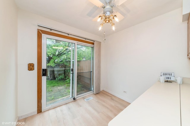 7400 Nantucket Cv, Hanover Park, IL 60133 - unfurnished dining area featuring wood finished floors and a ceiling fan