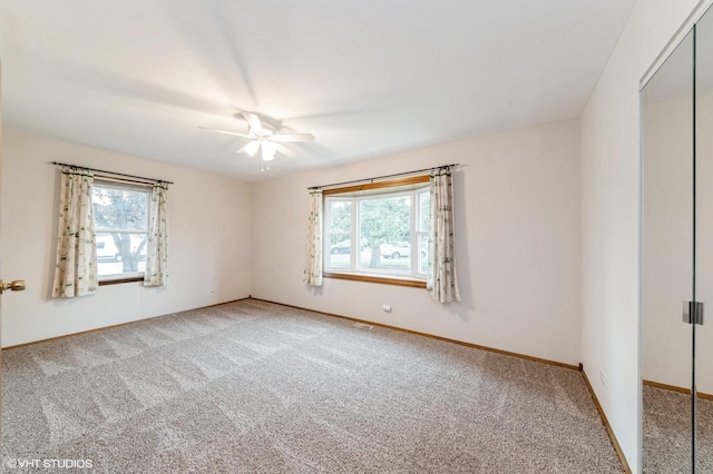 7400 Nantucket Cv, Hanover Park, IL 60133 - unfurnished room with light carpet, plenty of natural light, and a ceiling fan
