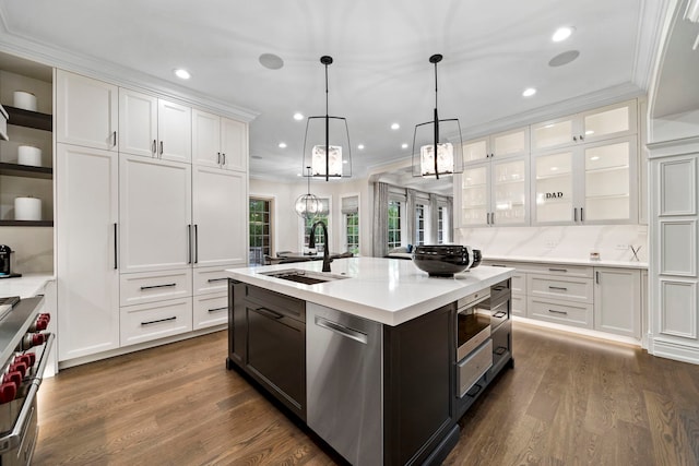 6403 S Garfield Ave, Burr Ridge, IL 60527 - kitchen with appliances with stainless steel finishes, light countertops, white cabinetry, ornamental molding, and dark wood-style floors
