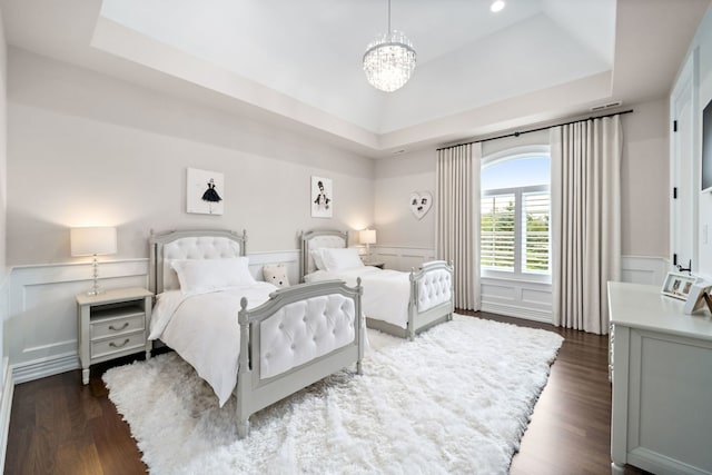 6403 S Garfield Ave, Burr Ridge, IL 60527 - bedroom with a raised ceiling, a chandelier, a decorative wall, dark wood-style flooring, and wainscoting