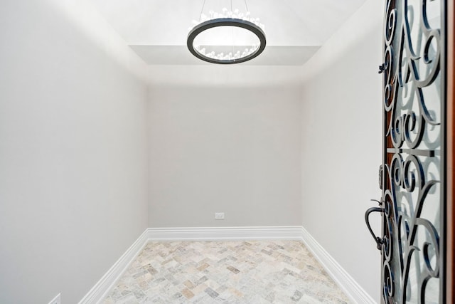6403 S Garfield Ave, Burr Ridge, IL 60527 - unfurnished room with a chandelier and baseboards