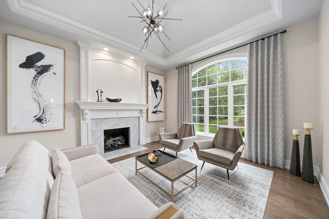 6403 S Garfield Ave, Burr Ridge, IL 60527 - living area featuring a chandelier, a tray ceiling, wood finished floors, and crown molding