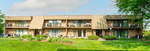 11104 O Gorman Dr Unit 41B, Palos Hills, IL 60465 - rear view of property with a balcony and a yard