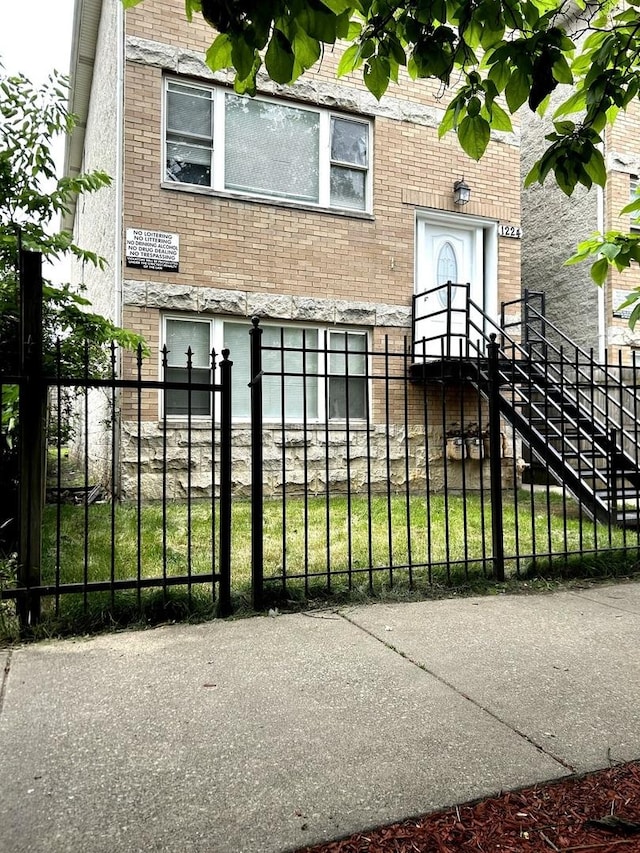 1224 S Harding Ave, Chicago, IL 60623 - view of front of property featuring brick siding and a fenced front yard