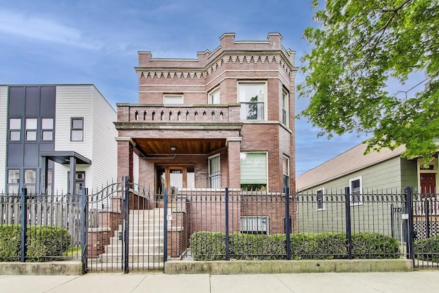 2333 N Spaulding Ave, Chicago, IL 60647 - view of front facade featuring brick siding and a fenced front yard