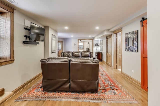 2333 N Spaulding Ave, Chicago, IL 60647 - living room featuring light wood finished floors, recessed lighting, and a barn door