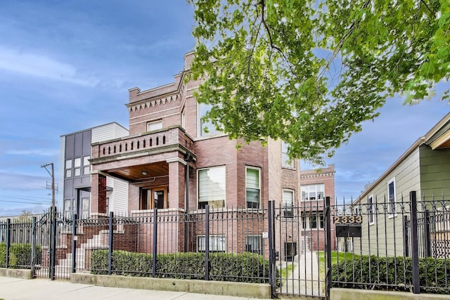 2333 N Spaulding Ave, Chicago, IL 60647 - view of front facade featuring a fenced front yard and brick siding