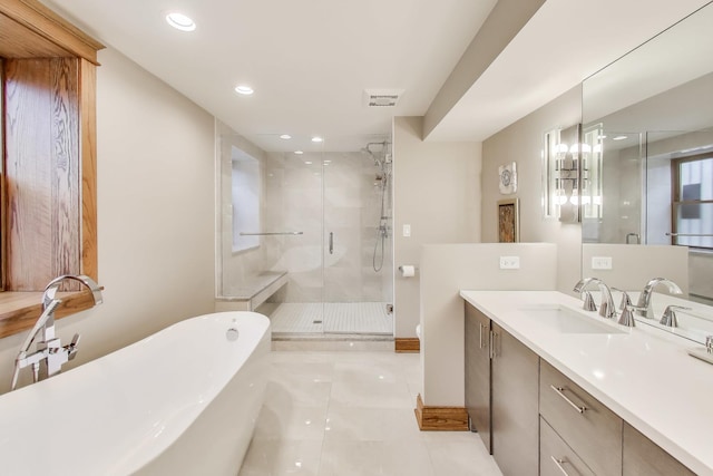 2333 N Spaulding Ave, Chicago, IL 60647 - bathroom featuring a soaking tub, a shower stall, vanity, tile patterned flooring, and recessed lighting