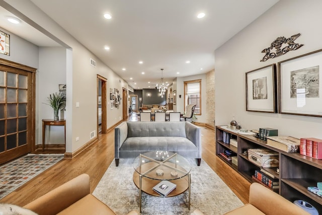 2333 N Spaulding Ave, Chicago, IL 60647 - living room featuring light wood-style flooring, recessed lighting, and a chandelier