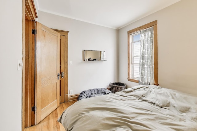2333 N Spaulding Ave, Chicago, IL 60647 - bedroom with light wood-style floors and ornamental molding